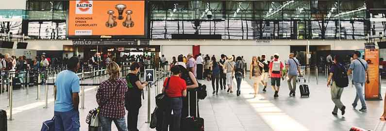 People queuing at the airport for their flight